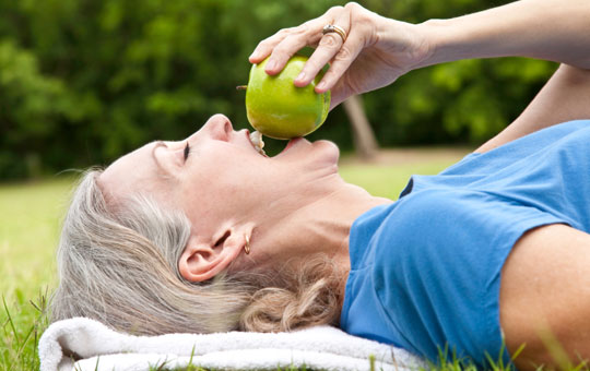 Eating an apple to stay healthy.